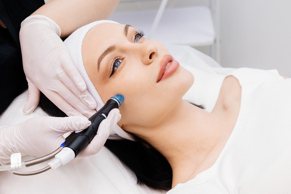 Woman has glowing radiant skin with non-invasive treatments to tackle early signs of aging.
